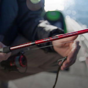 Close-up of the Ugly Stik Carbon rod blank and logo in use on the water.