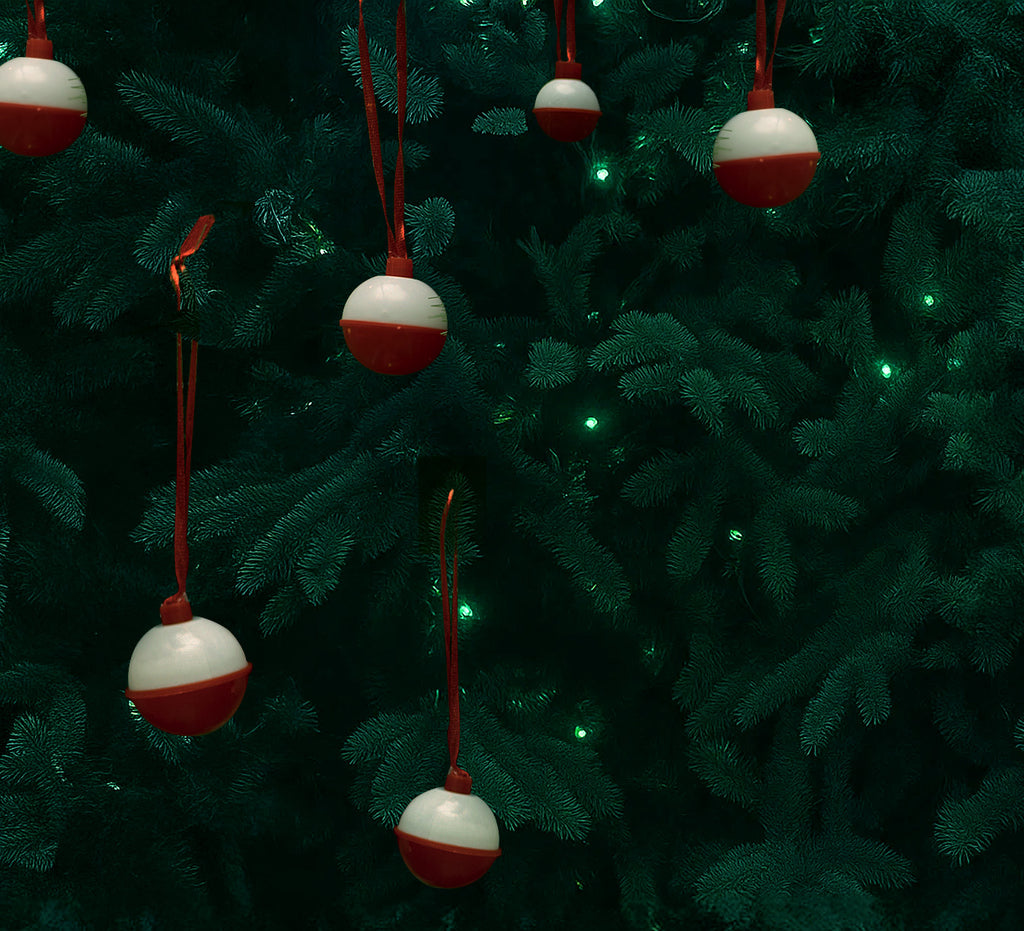 Red and white ornaments hanging on a Christmas tree